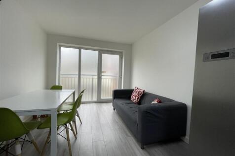 Bright modern living area with dining set...