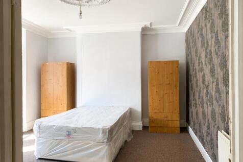 Bright bedroom with elegant ceiling rose detail...
