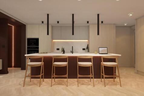 Sleek modern kitchen with breakfast bar island...