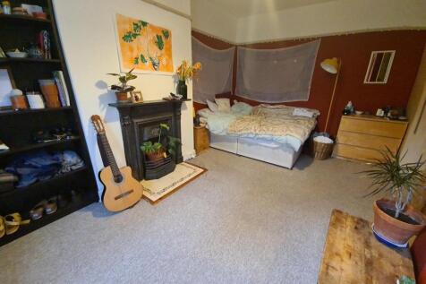 Bright, neatly presented bedroom with a comfort...