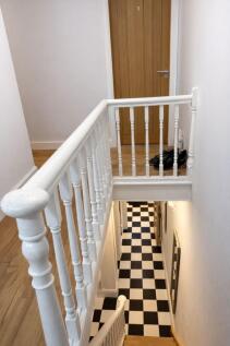 Bright, freshly painted stairwell with classic ...