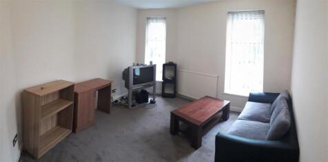 Bright furnished living room with a comfortable...