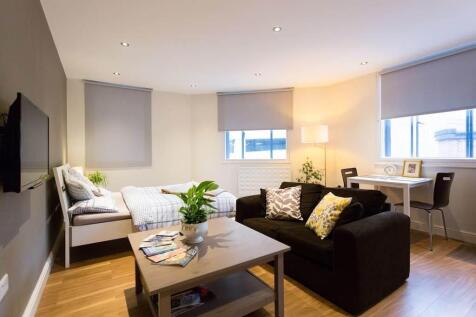 Stylish open-plan suite with bright study area...