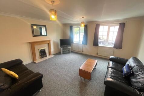 Bright, well-kept living room with two large fr...