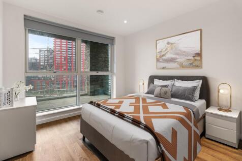 Experience luxury and tranquility in this chic urban bedroom with stunning views.