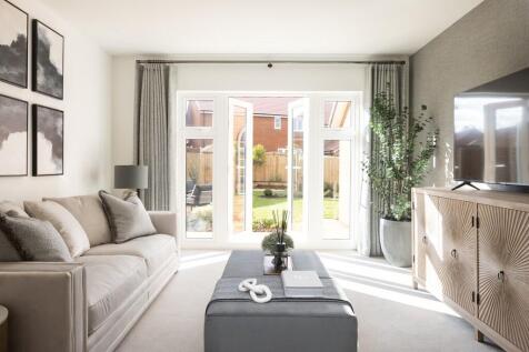 the hawthorn sitting room with french doors to garden. ingatestone grove
