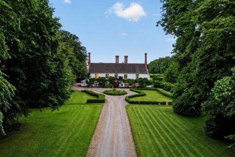 Aerial view of Bury's Hall with formal gardens and