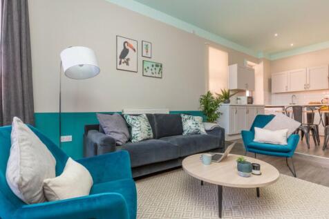 A stylish and spacious modern living room, perf...