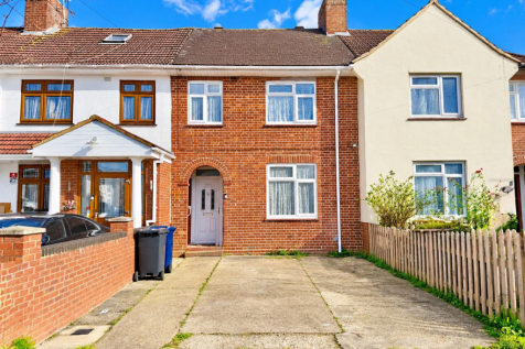 Sunlit Terraced Houses in Blue Skies.png