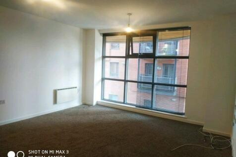 Bright, airy room with large floor-to-ceiling w...