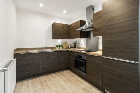 Experience culinary delight in this sleek modern kitchen, a harmonious blend of style and functionality.