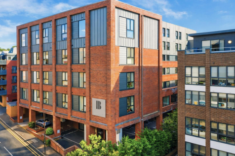 Benedicts Apartments in vibrant city setting.png