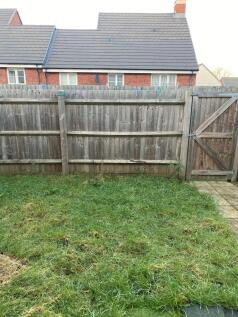 Private rear garden with enclosed wooden fence,...