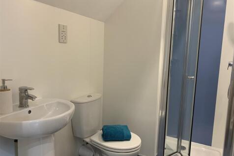 Compact bathroom with shower and fresh fixtures...