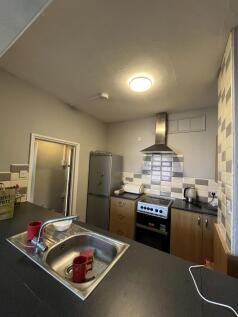 A functional kitchen with stainless steel appli...