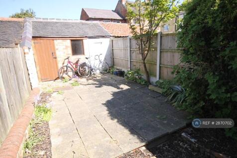 Rear Garden With Storage And Coal/Recycling Sheds 