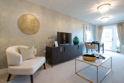 a living room with a white couch and a round table