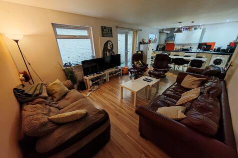 Spacious open-plan living area with sofas...
