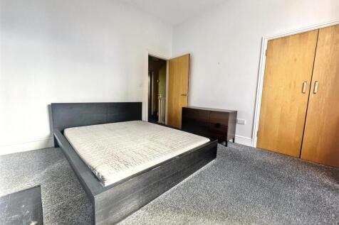Spacious double bedroom with built-in storage...
