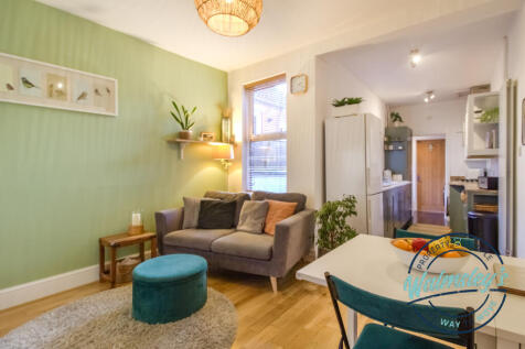 Sitting room with open plan kitchen