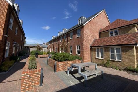 Bright communal courtyard with picnic seating...