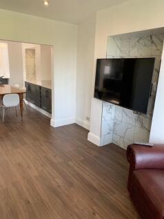 Modern and well-maintained living room featurin...