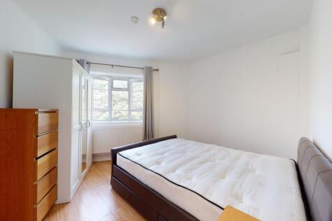 Bright bedroom with double bed and ample storag...