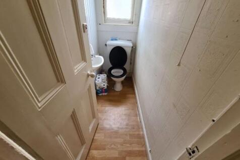 Compact and functional toilet room featuring wo...