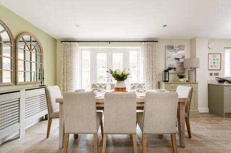 Double doors lead out from the dining area to the garden