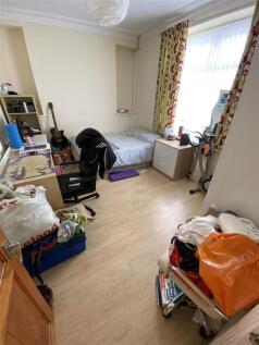 Bright bedroom with desk and ample floor space...