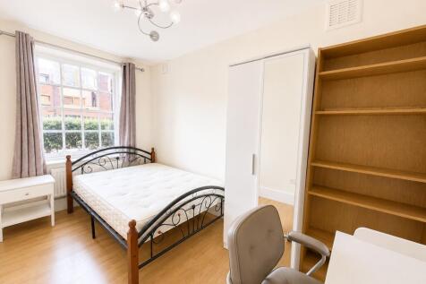 Bright bedroom with ample storage and desk area...
