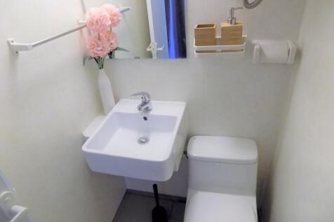 Compact, well-kept bathroom with a modern wall-...