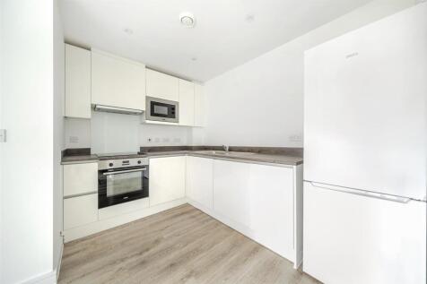 Bright modern kitchen with high-gloss cabinets...