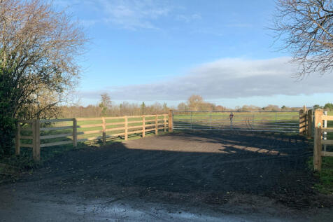 Direct access via a double-gated entrance set-back from the road.