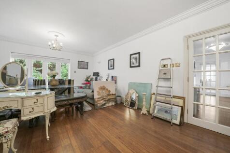 Bright and airy lounge with elegant coving...