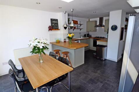 Modern open kitchen with stylish dining area...