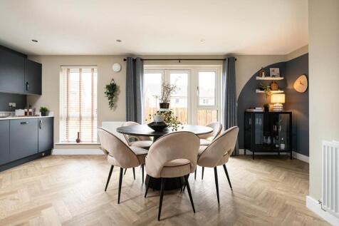 Double doors lead from the dining area to the garden, perfect for al fresco dining