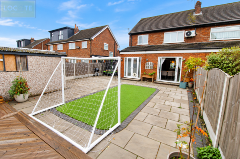 Sunny Suburban Garden with Soccer Goal