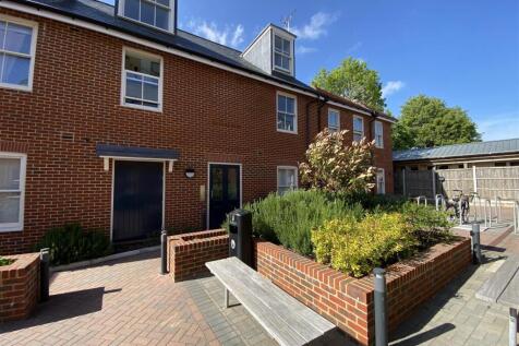Well-kept brick frontage with landscaped courty...