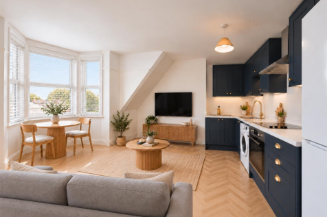 Left-shifted sofa opens a clear kitchen walkway.pn