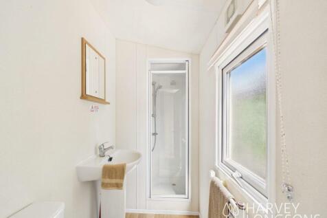 Family bathroom with shower, sink and toilet