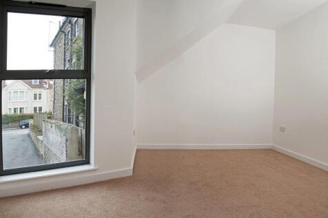 Bright and airy room with large modern window...