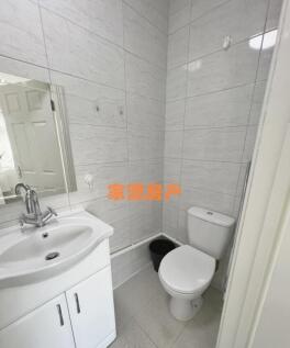 A clean and modern small bathroom featuring a w...