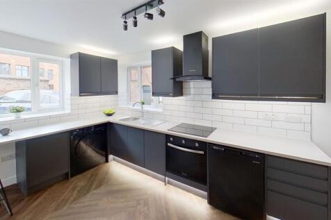 Sleek, modern kitchen with ample counter space....