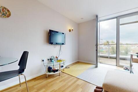 Bright living room with private balcony access...