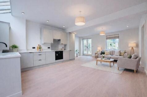 Open plan living area with wooden floor
