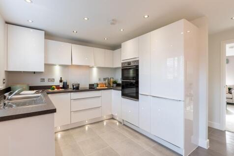 Modern 3-sided kitchen has ample worktop and storage space