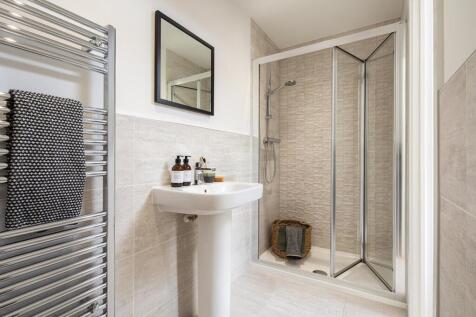 En suite to bedroom 1 with full width shower cubicle