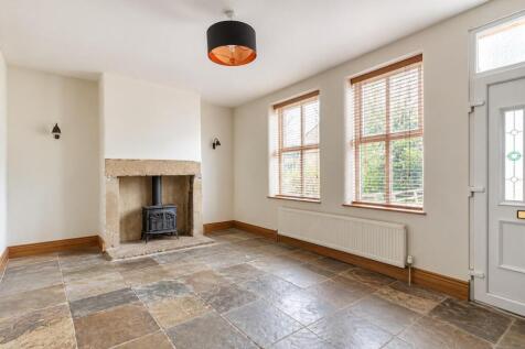 Empty Cottage Living Room with Stone Fireplace (1)