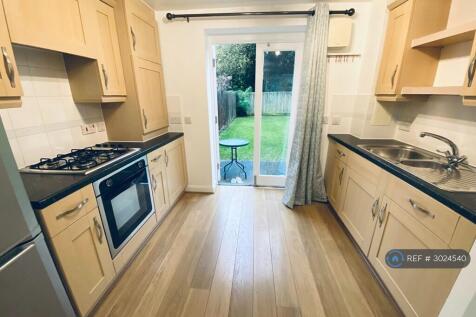 Kitchen With Doors To Shared Garden